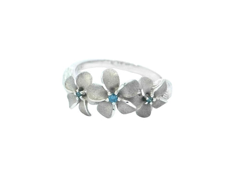 Three Plumeria Ring in White Gold with Blue Diamonds
