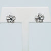 White Gold Plumeria Stud Earrings with Blue Diamonds